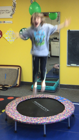 Bouncing on a trampoline to self regulate and learn body movement control